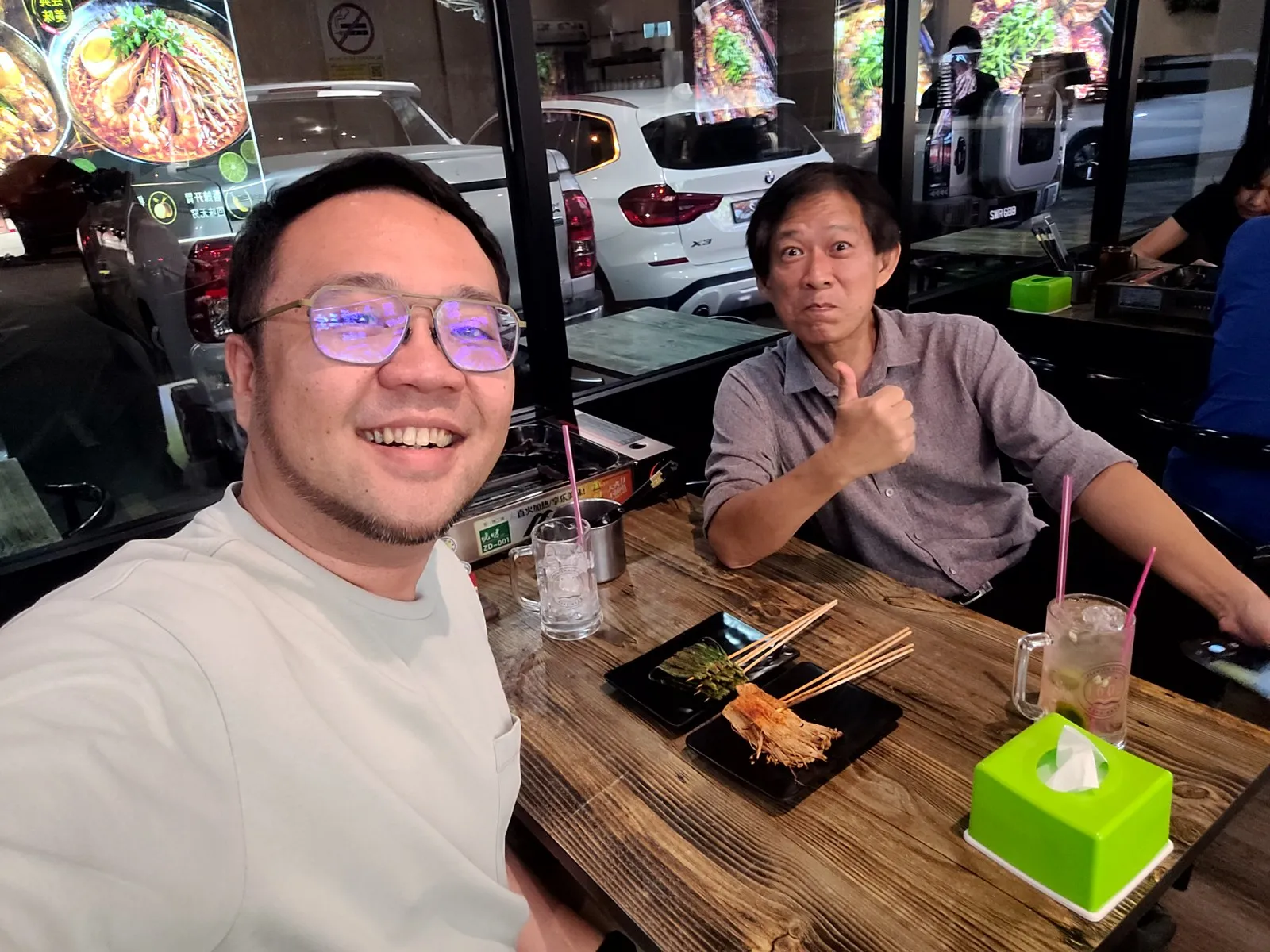 Selfie with a friend over satay