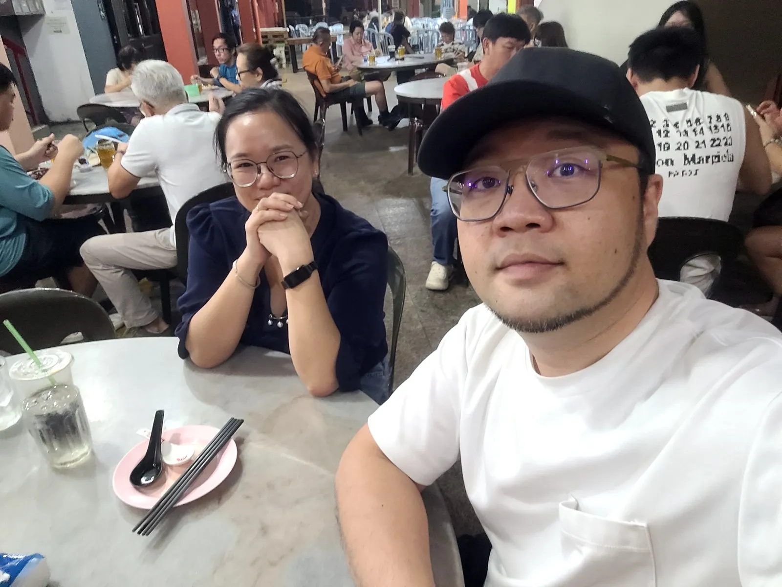 My wife and me at a kopitiam table