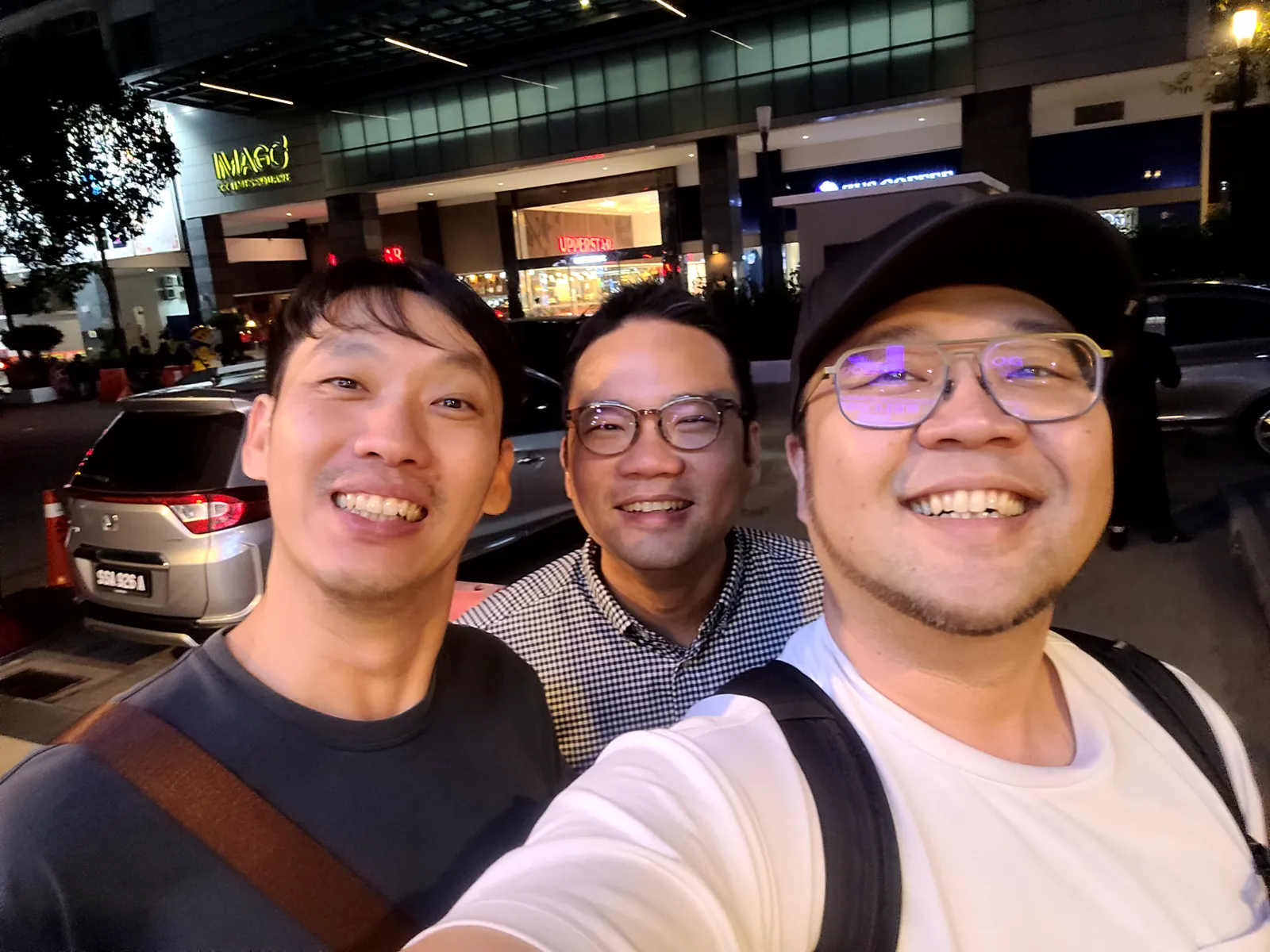 Selfie with two friends outside at night