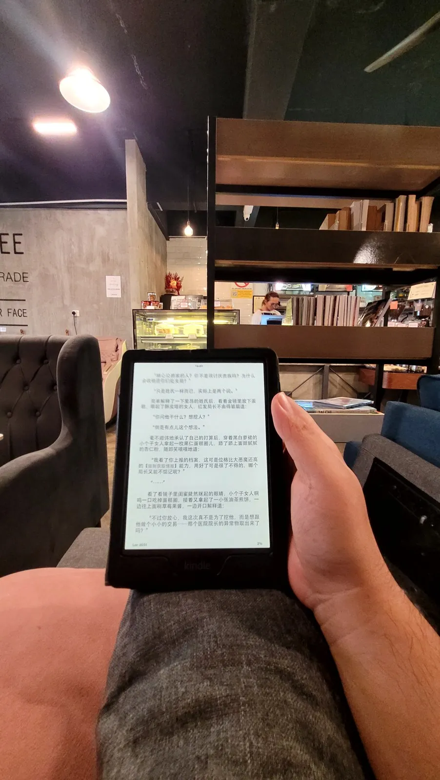 Reading on a Kindle in a cafe