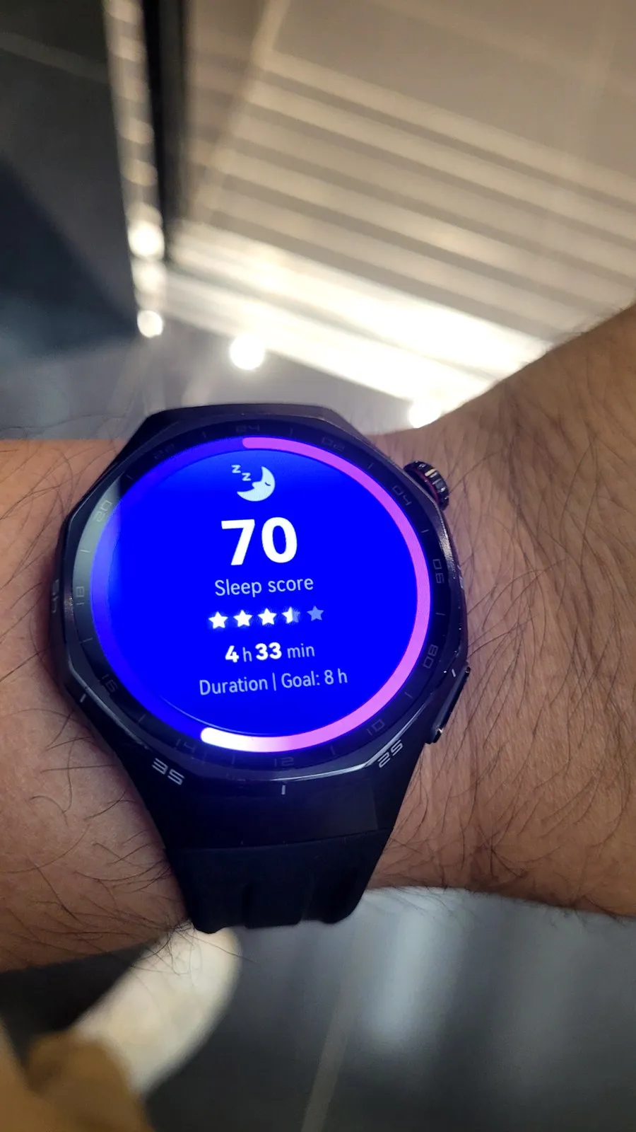 Watch showing sleep score 70, 4 hours 33 minutes