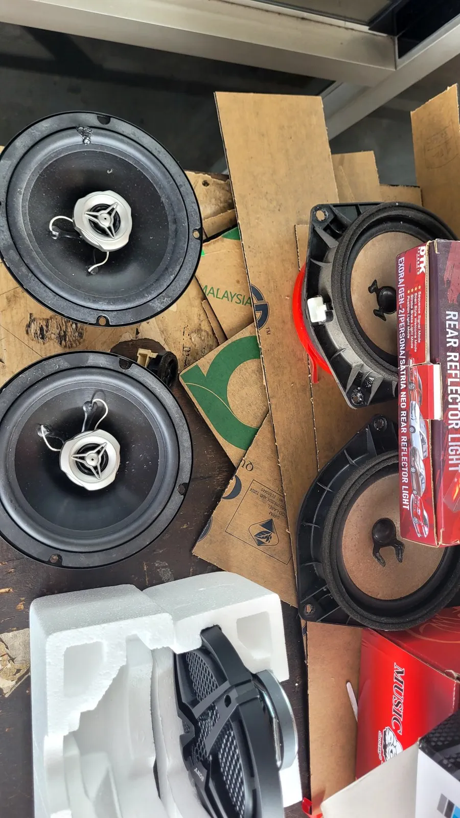 New speakers laid out on cardboard